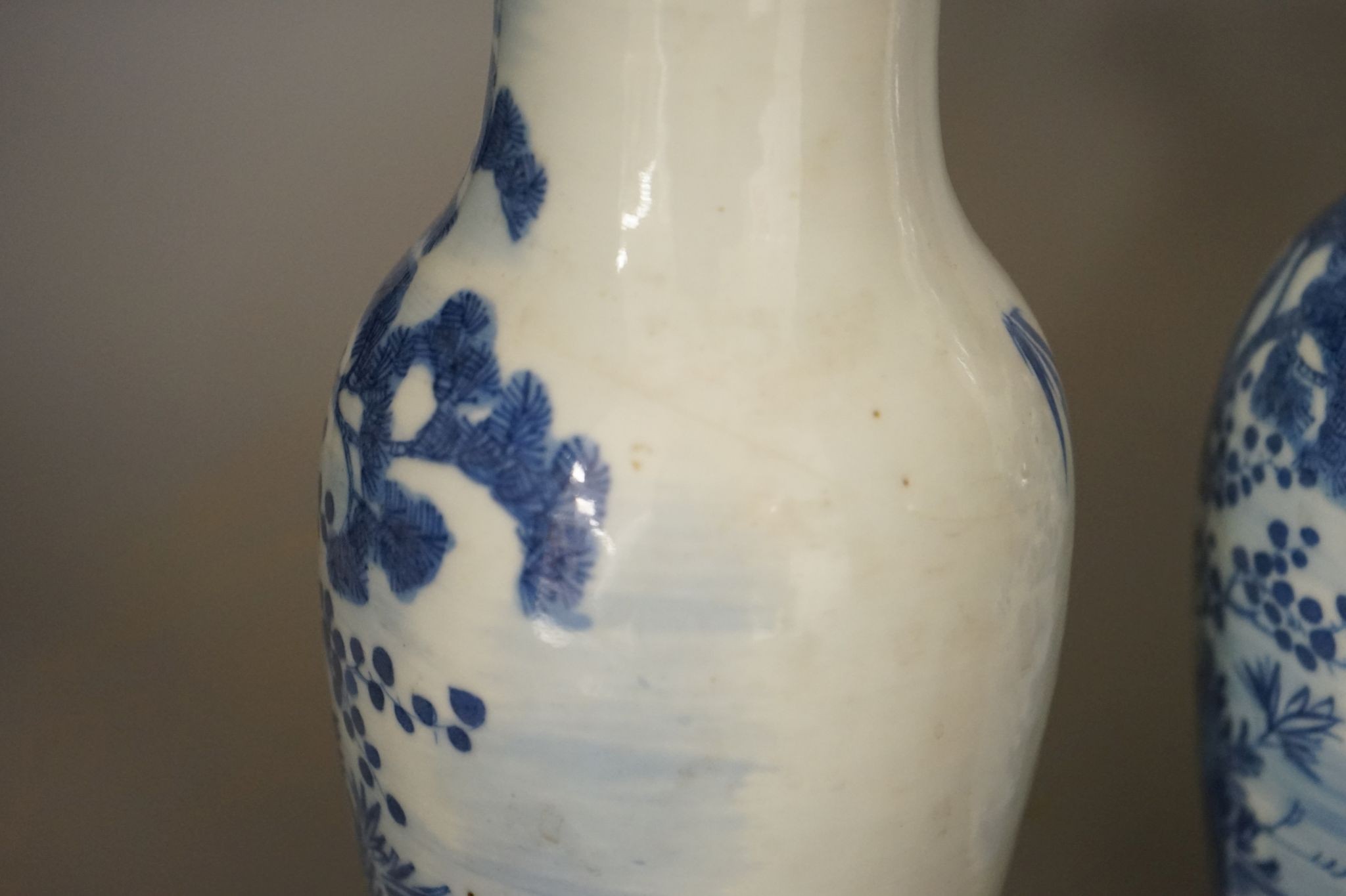 A pair of 19th century Chinese blue and white three friends of winter vases 22cm